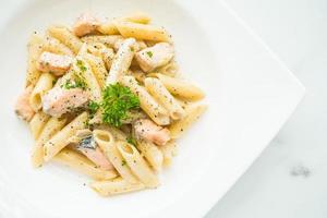 Penne carbonara pasta with salmon photo