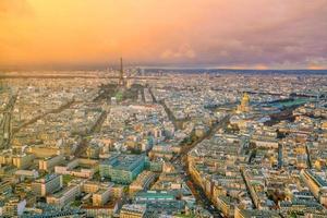 Skyline of Paris with Eiffel Tower at sunset in France photo