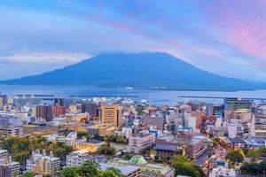 Kagoshima city downtown skyline cityscape  with Sakurajima Volcano in Kyushu, Japan photo