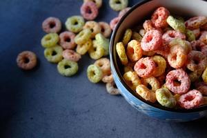 Colorful cereal in blue bowl photo