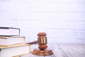 Gavel and books on neutral background photo