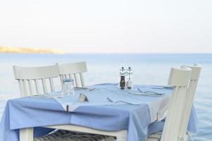 Cafe tables on the sea, selective focus photo