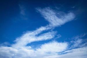 Wind blown abstract white cloud photo