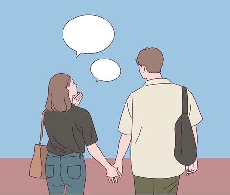 The back view of a man and a woman walking hand in hand.