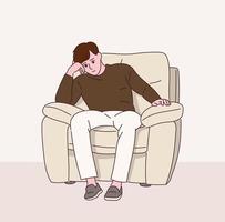 A man is pensive sitting on a sofa with a serious expression. vector