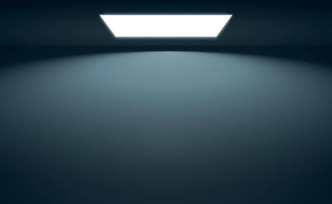 Black panoramic studio background with white glow