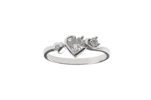 Heart-shape diamond ring on isolated a white background photo