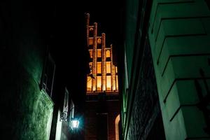 Tourist area of the old town in night Warshawa photo