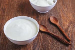 Yogurt with wooden spoons photo