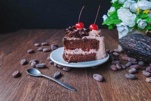Chocolate cake and flowers photo