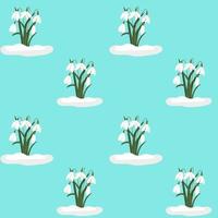 Seamless background with snowdrops. Vector repeating pattern with white flowers on a blue background. Background.