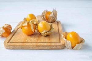 Cape gooseberry fruit on a board photo