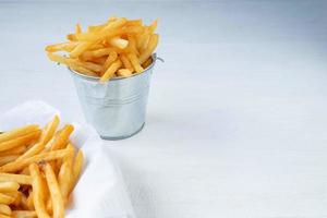 Bucket and basket of fries photo