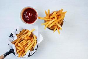 Fries and ketchup top view photo