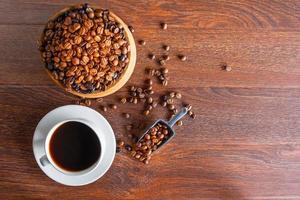 Top view of coffee beans and cup of coffee photo