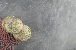 Green sweet doughnuts with sprinkles photo