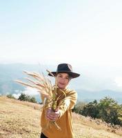 Woman holding out rice photo