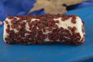 Sweet dessert with dried fruit on a wooden blue board photo