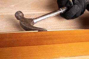 Hammer on wood photo