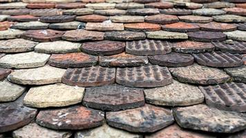 Ceramic roof tiles on an old roof in Geneva, Switzerland photo