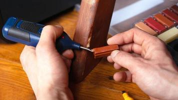 Person restoring wood photo