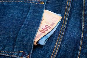 Money in a jeans pocket photo