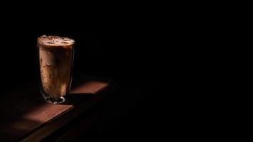Iced coffee with milk on the table photo