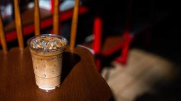 Close-up of iced coffee with milk on a chair photo