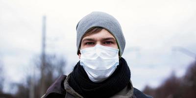 Young man in a protective mask photo