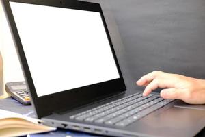 Businessman's hand working on laptop computer, technology concept photo