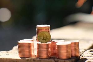 Bitcoin cryptocurrency coin and euro coin on table