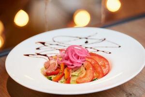 A photo of a mint and dolendwitz salad in a restaurant on the table