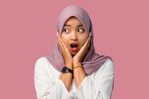 Shocked young woman wearing a hijab photo