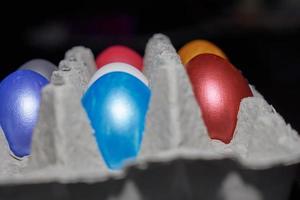 Close up of pearl-colored eggs for Easter in an egg tray photo