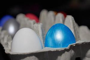 Close up of pearl-colored eggs for Easter in an egg tray photo