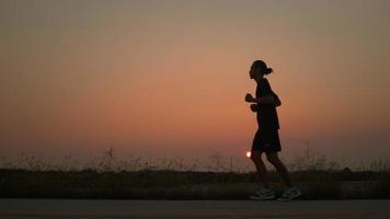 Silhouette Runner Runs on Street in Countryside with Fresh and Clear Air, Man Running or Workout