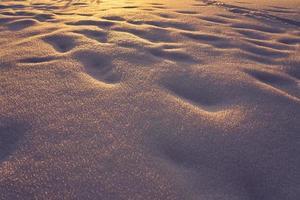 Textura de nieve en una helada tarde al atardecer foto