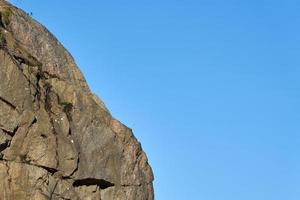 Granite rocks in the sun in spring with a blue sky photo