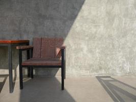 Wooden chair outside on concrete patio photo