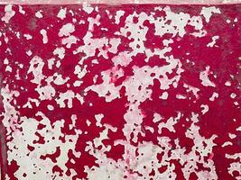 Red peeling paint texture background photo