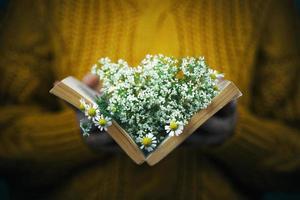 Girl with book and bouquet photo