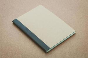 Notebook mock up on wood background photo