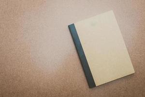 Notebook mock up on wood background photo