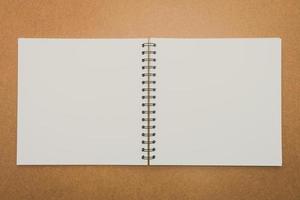 Notebook mock up on wood background photo