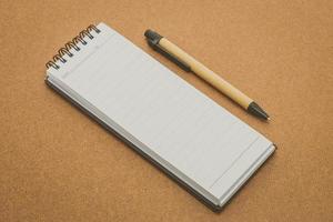 Notebook mock up on wood background photo