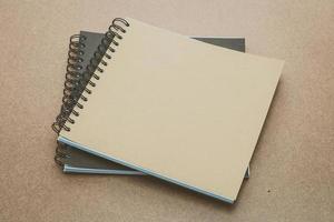 Notebook mock up on wood background photo