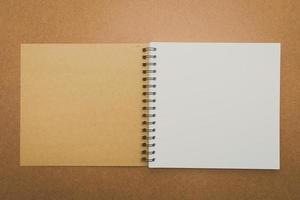 Notebook mock up on wood background photo