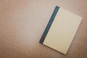Notebook mock up on wood background photo