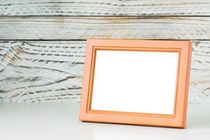 Frame on wood table photo