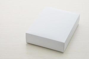 Paper box on wood background photo